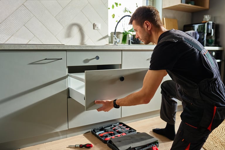 Man assembling kitchen drawer