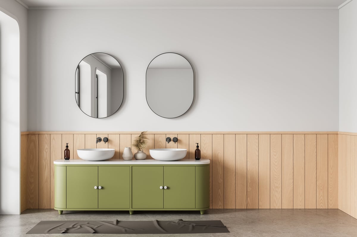 Bathroom with olive green vanity and vessel sinks