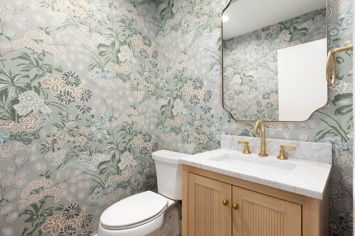 Bathroom with marble countertop on white oak cabinet
