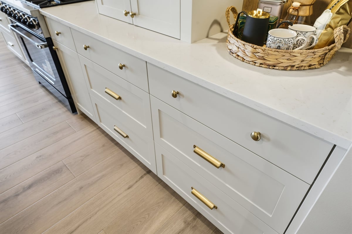 White cabinet kitchen with wooden floor