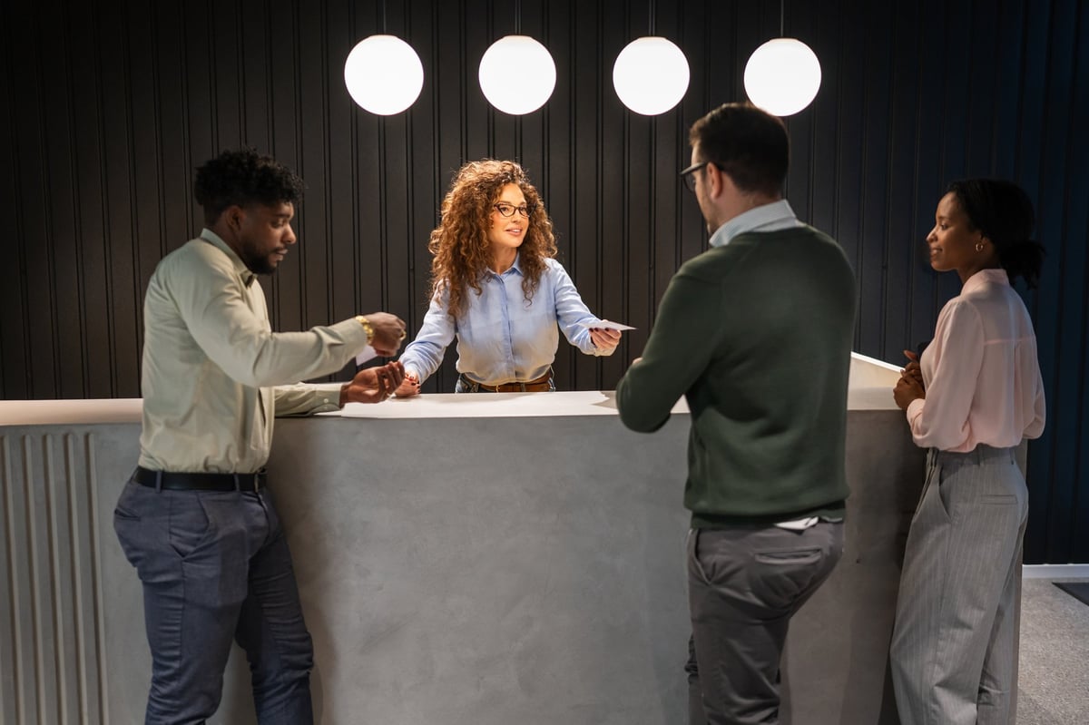 Business people at modern reception desk